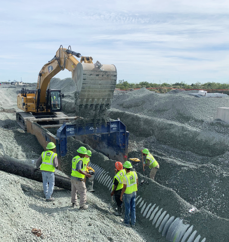 project workers with a pipe and digger